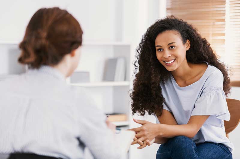 Girl speaking with a therapist