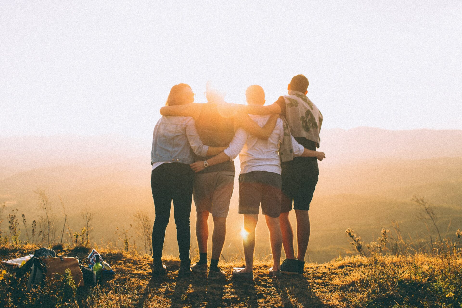 group of friends looking at sunset